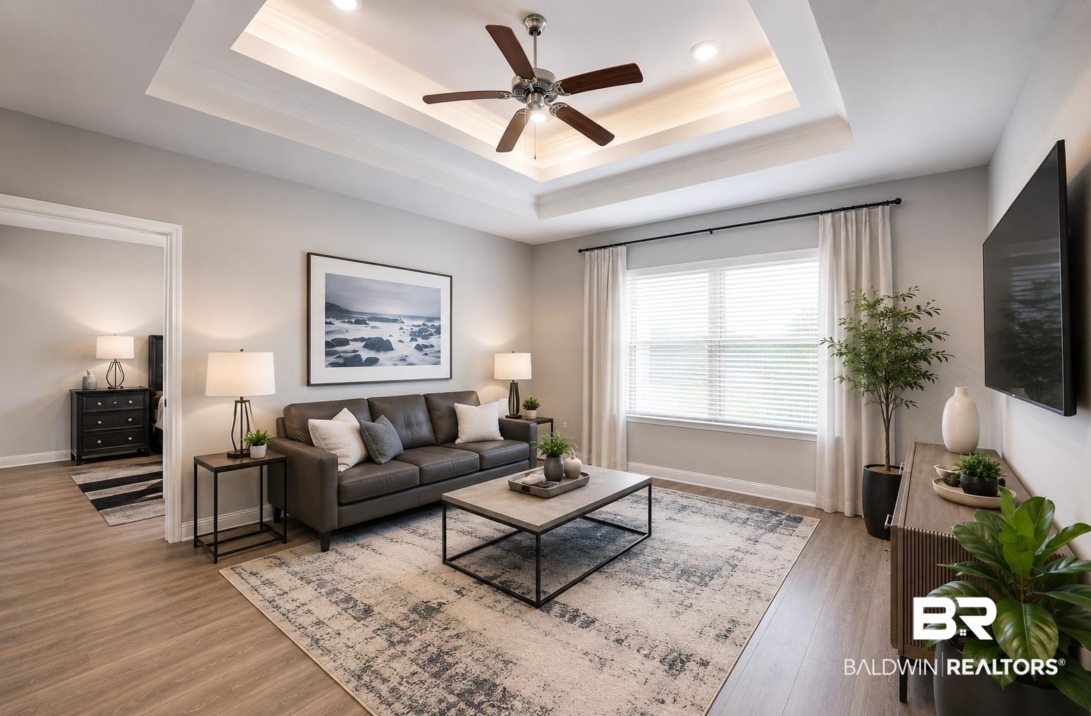 31468 Memphis Loop Daphne, AL 36527 - Photo 2 of 24 Living area featuring a tray ceiling with recessed lighting and a ceiling fan