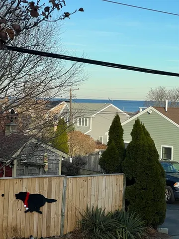 a view of a street with a building in the background