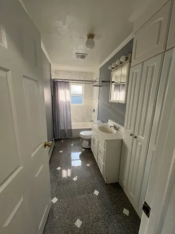 a view of a bathroom with tub sink