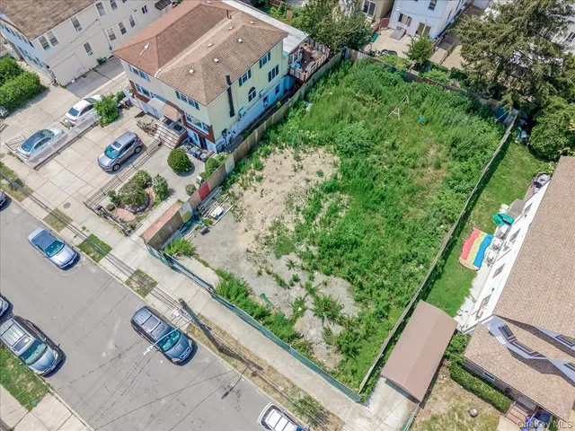 an aerial view of residential house with outdoor space