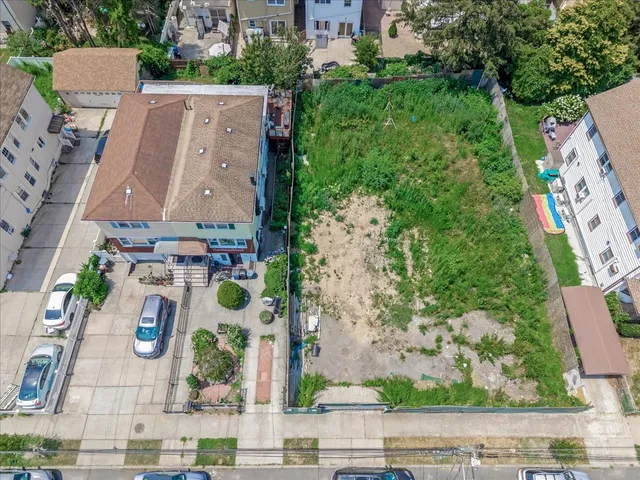 an aerial view of a house with outdoor space