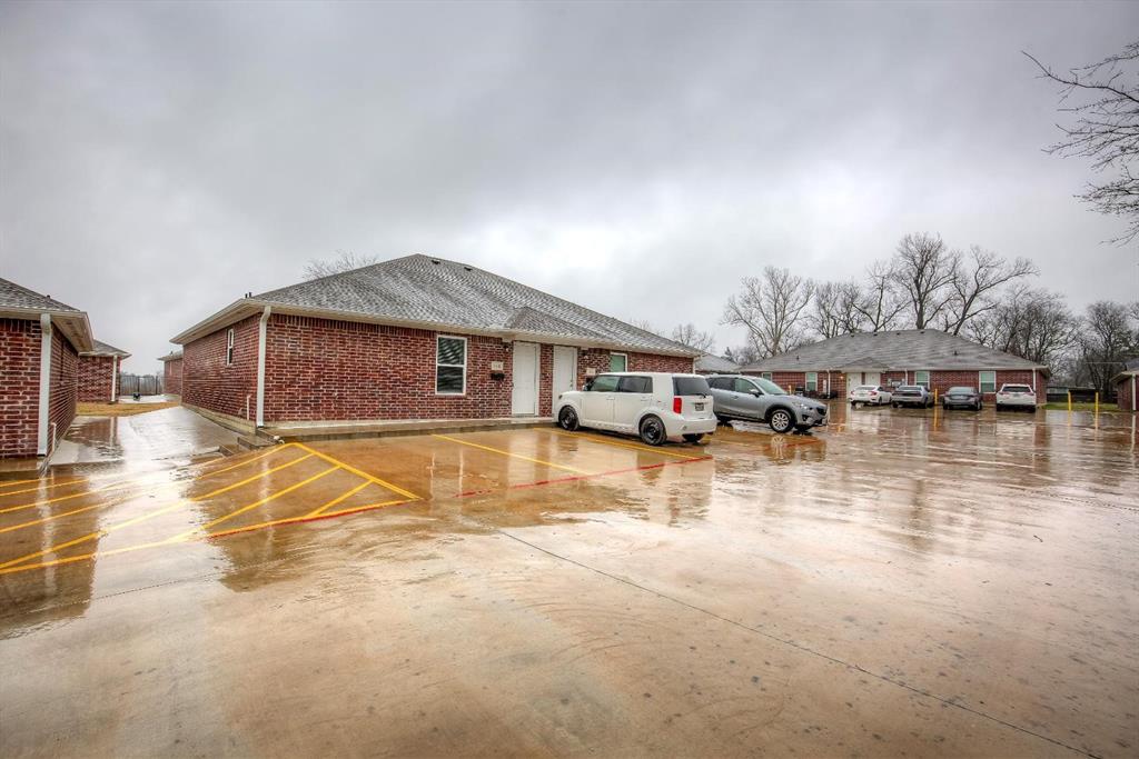 800 Sycamore Street Commerce, TX 75428 - Photo 8 of 8 a swimming pool with outdoor seating and yard