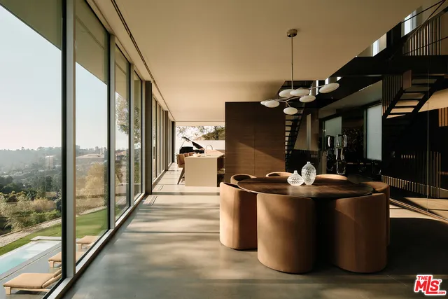 a dining room with large window