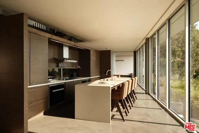a kitchen that has a cabinets and a stove top oven