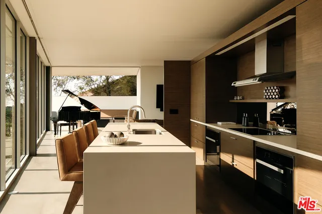 a room with furniture a flat screen tv and a floor to ceiling window