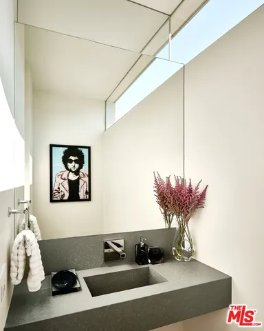 a table with a vase and flowers on it