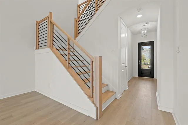 an entryway in a hall with a window