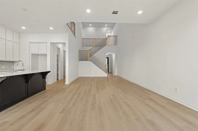 a view of kitchen with cabinets and wooden floor