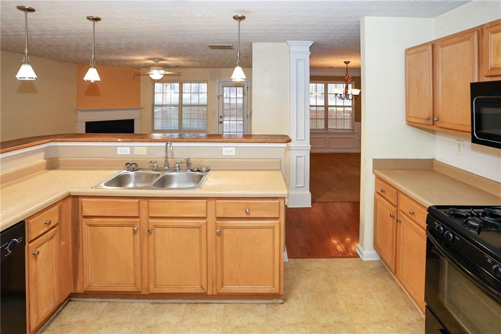 30 Emerson Trail Covington, GA 30016 - Photo 13 of 40 a kitchen with a sink and cabinets