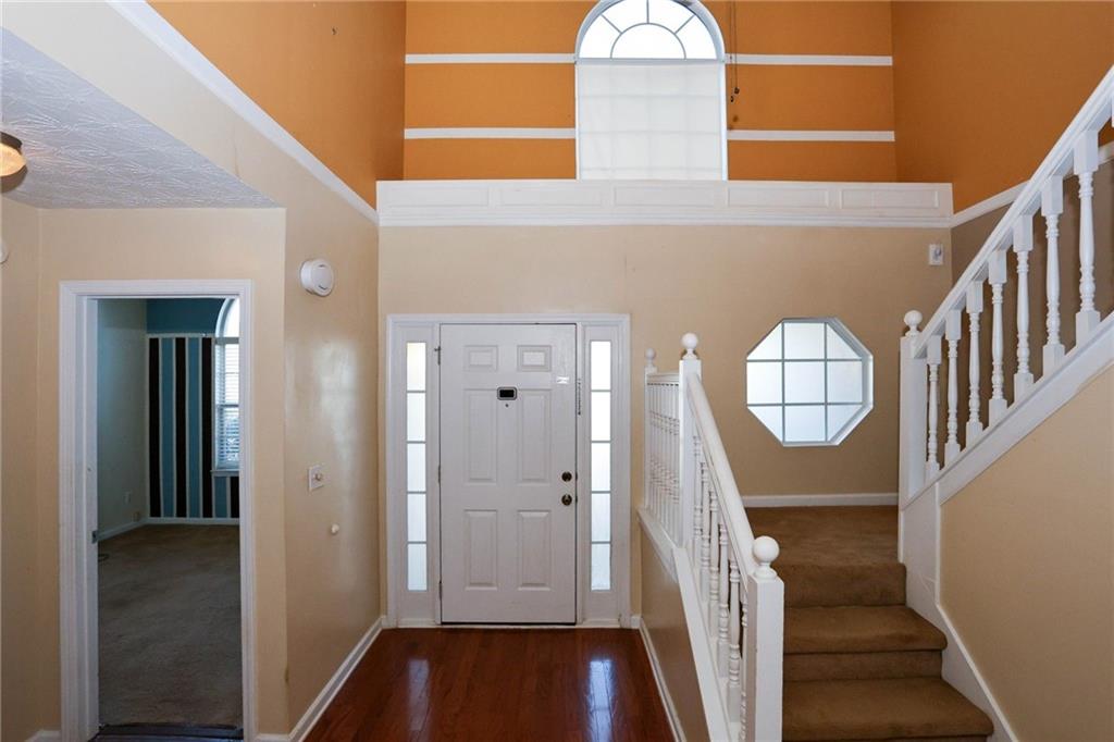 30 Emerson Trail Covington, GA 30016 - Photo 4 of 40 a view of front door with stairs