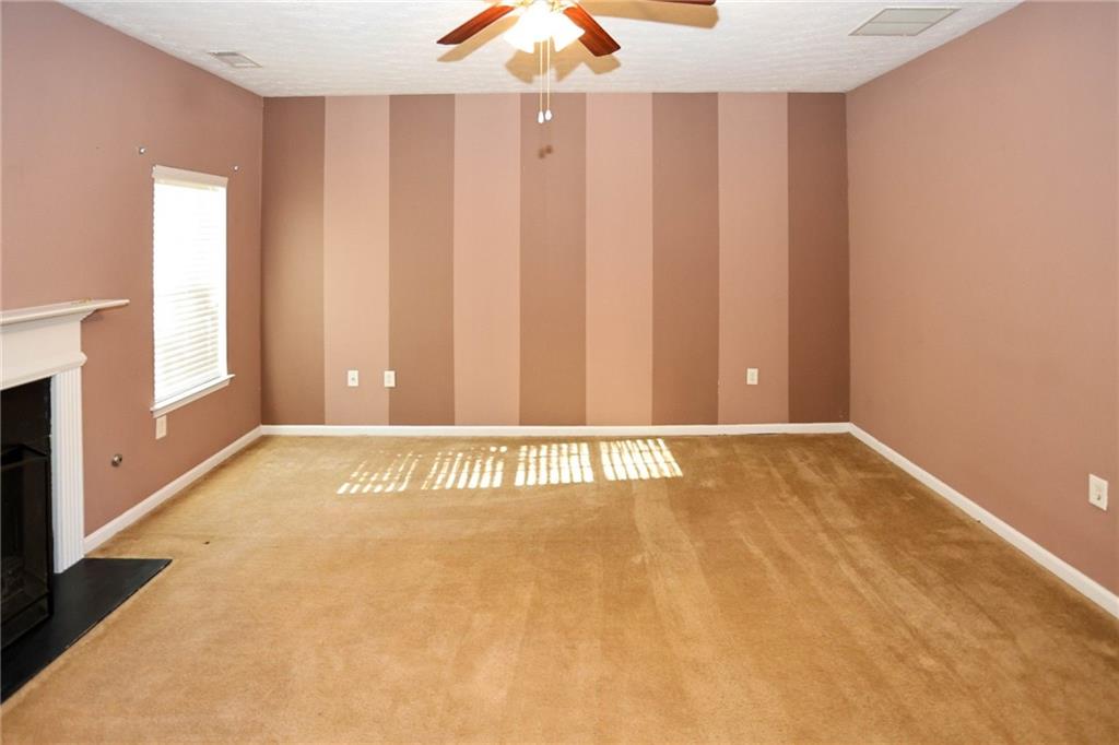 30 Emerson Trail Covington, GA 30016 - Photo 8 of 40 a view of a livingroom with wooden floor and a window