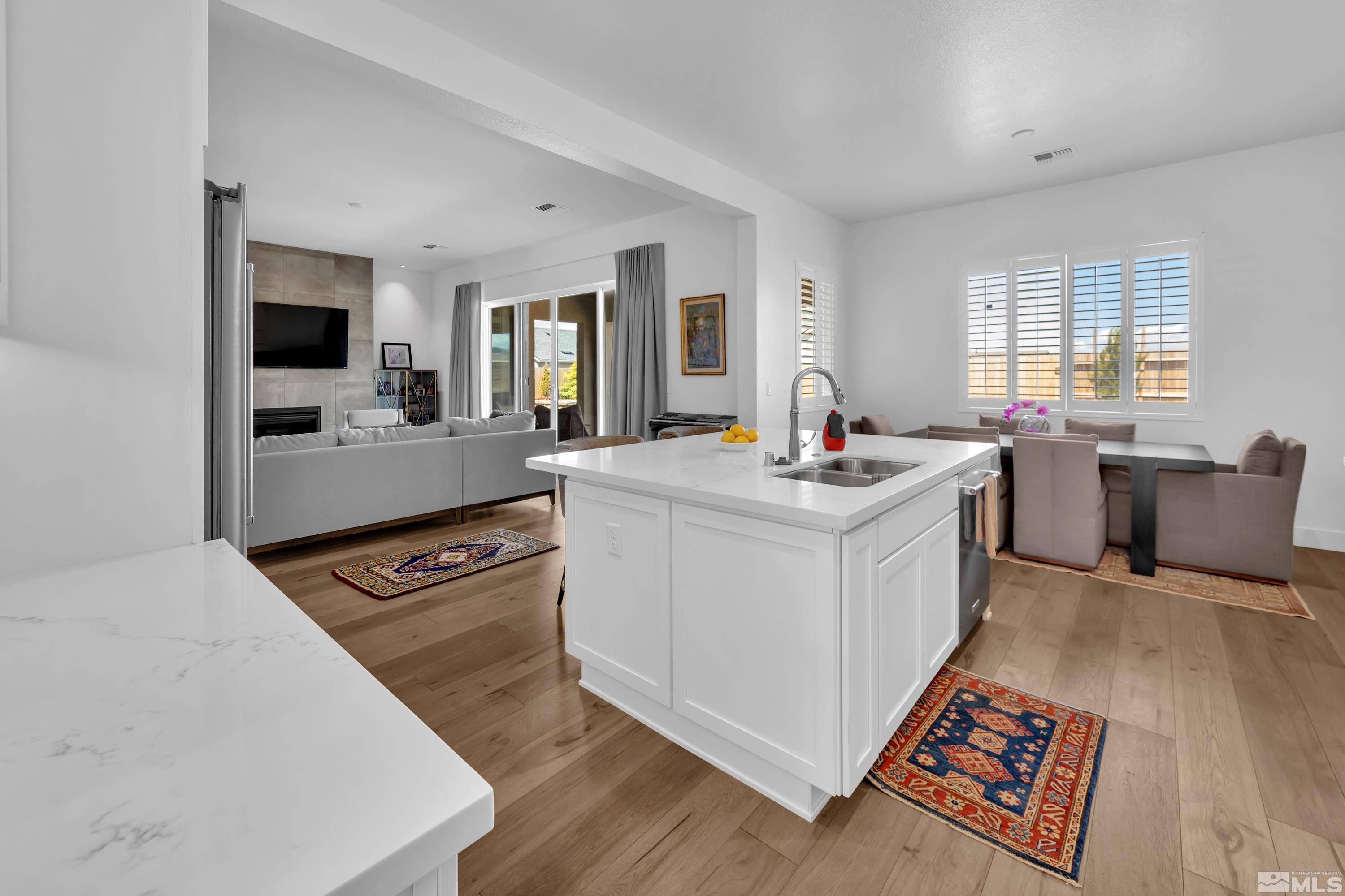 2201 Kate's Bridge Drive Reno, NV 89521 - Photo 15 of 39 a open kitchen with stainless steel appliances granite countertop a stove and a sink