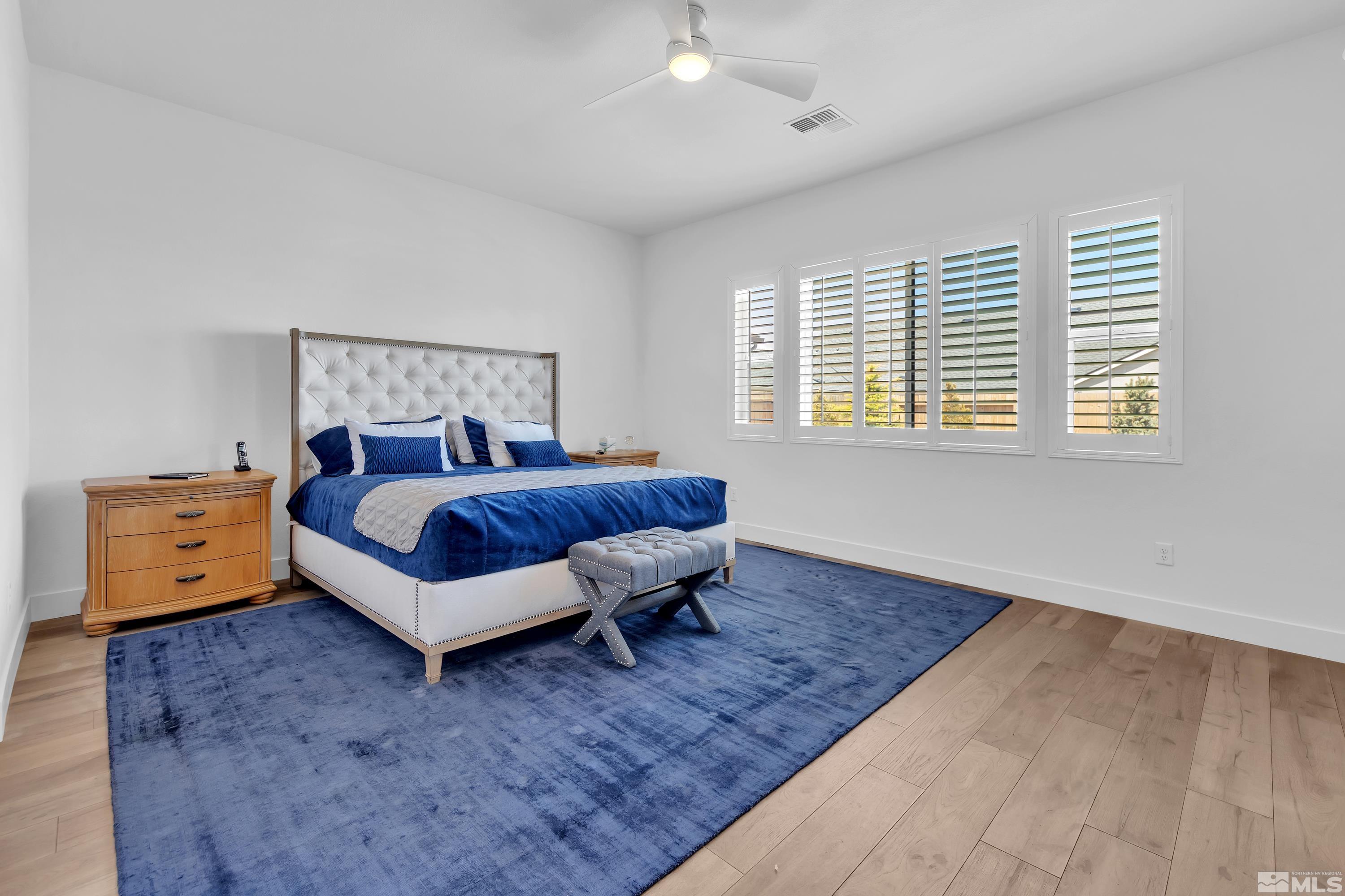 2201 Kate's Bridge Drive Reno, NV 89521 - Photo 19 of 39 a living room with a bed and a dresser