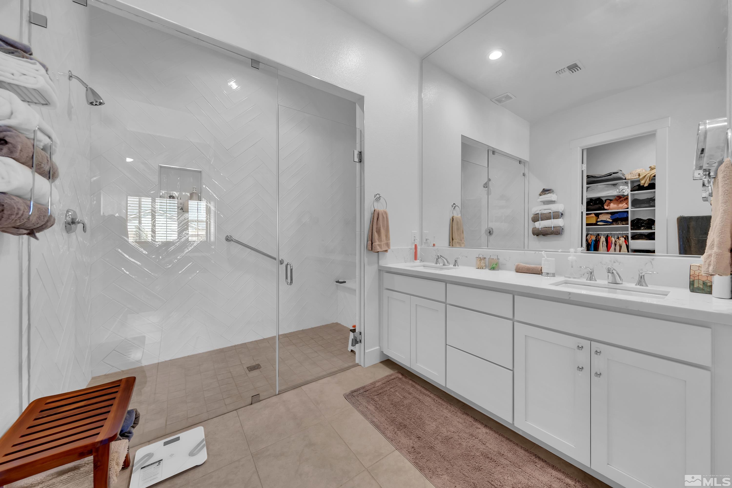2201 Kate's Bridge Drive Reno, NV 89521 - Photo 21 of 39 a bathroom with double vanity sink and a mirror