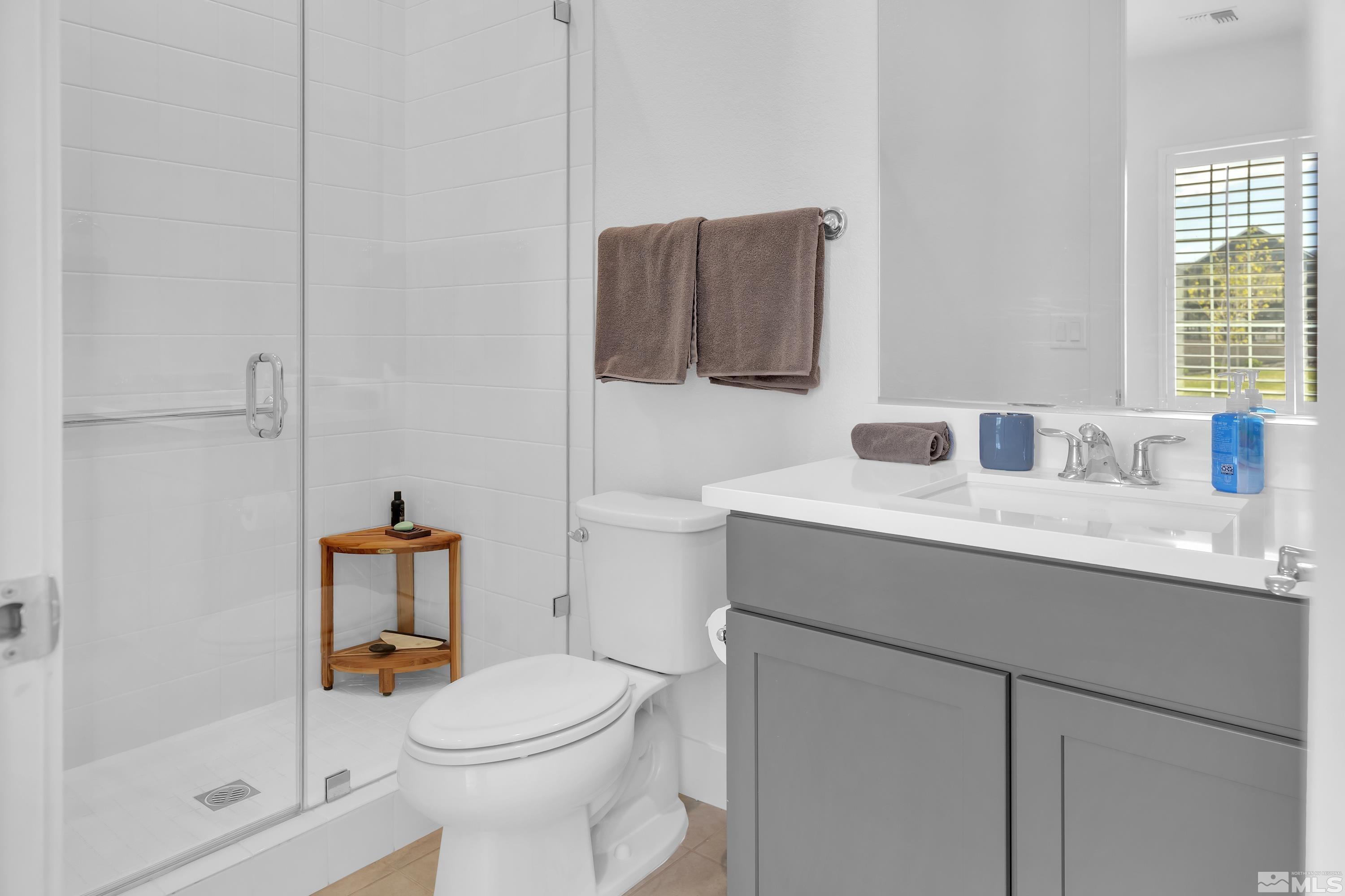 2201 Kate's Bridge Drive Reno, NV 89521 - Photo 28 of 39 a bathroom with a toilet sink and mirror