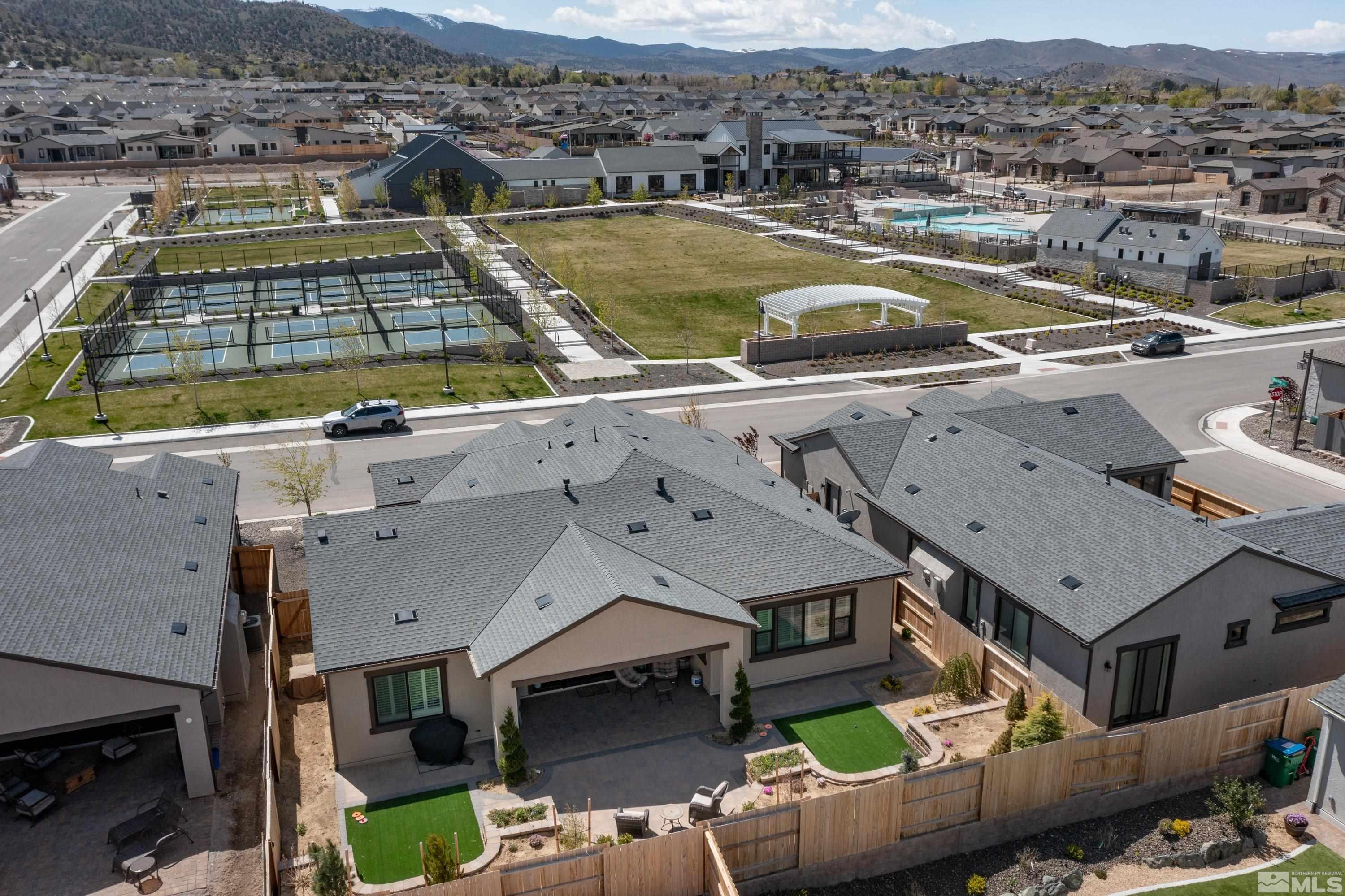 2201 Kate's Bridge Drive Reno, NV 89521 - Photo 33 of 39 an aerial view of a house with a swimming pool lake view and mountain view