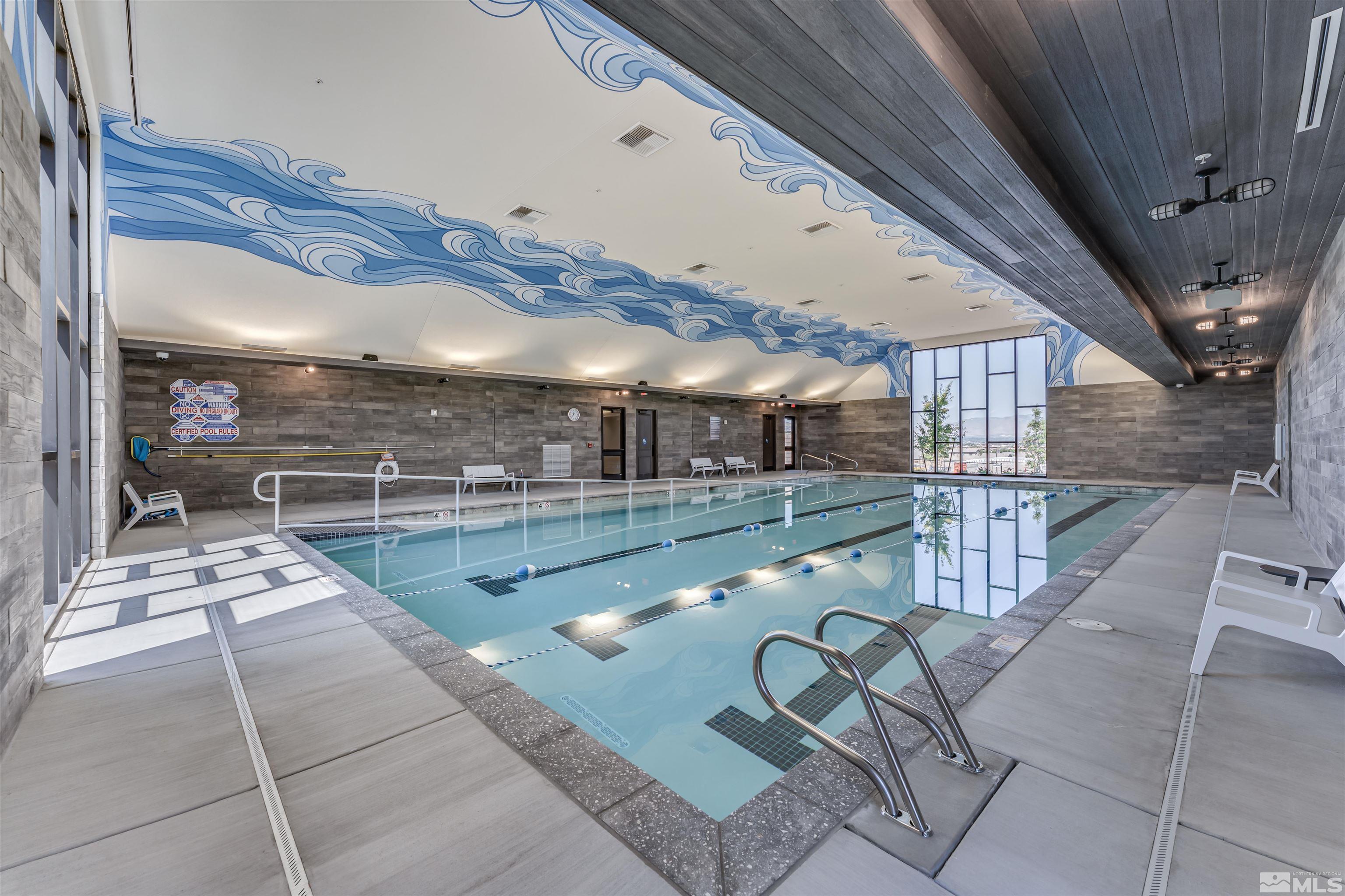 2201 Kate's Bridge Drive Reno, NV 89521 - Photo 38 of 39 a lobby with furniture and a rug