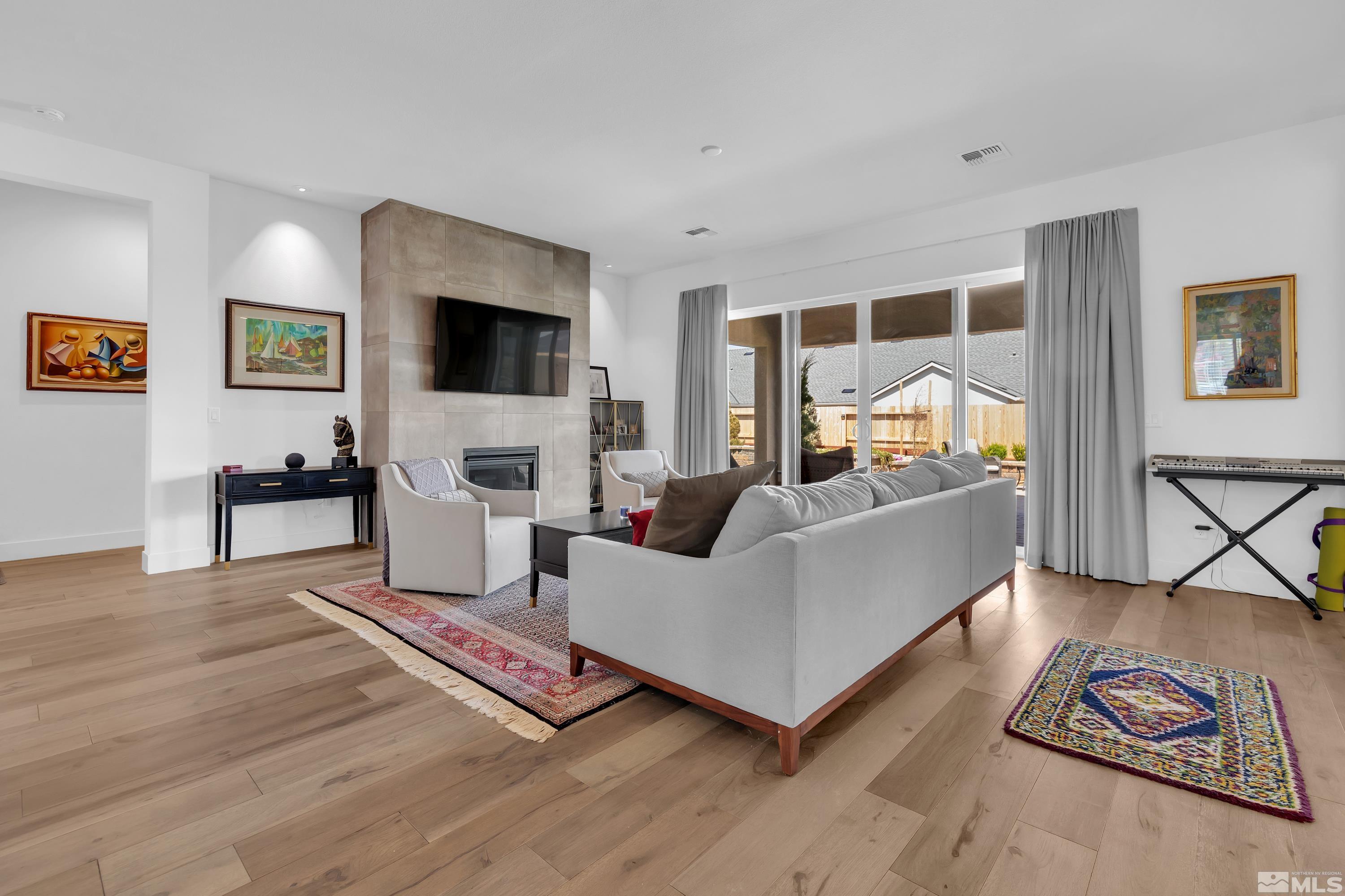 2201 Kate's Bridge Drive Reno, NV 89521 - Photo 6 of 39 a living room with furniture fireplace and flat screen tv