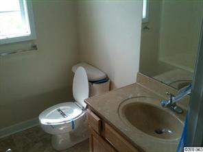 1029 Dameron Road Bessemer City, NC 28016 - Photo 8 of 12 a white toilet sitting next to a window