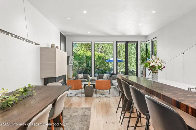 a view of a dining room with furniture window and outside view