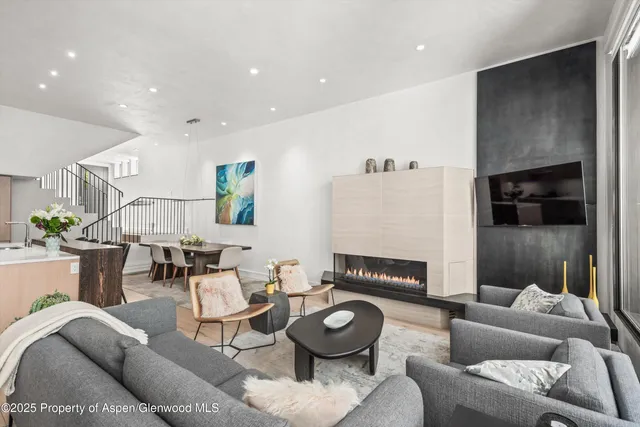 a living room with furniture and a table