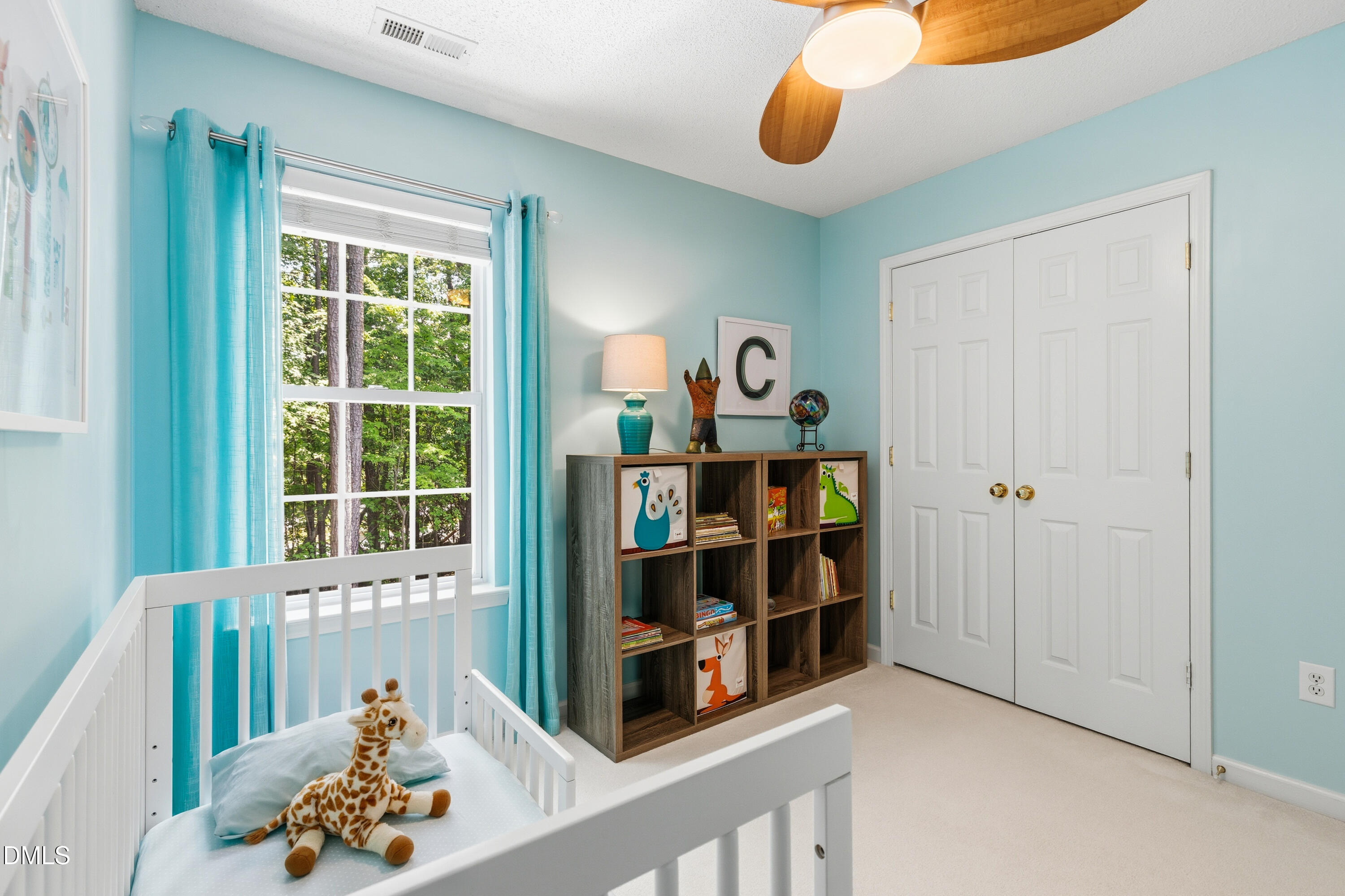 1211 Waterford Green Drive Apex, NC 27502 - Photo 40 of 53 a room with a book shelf and a window