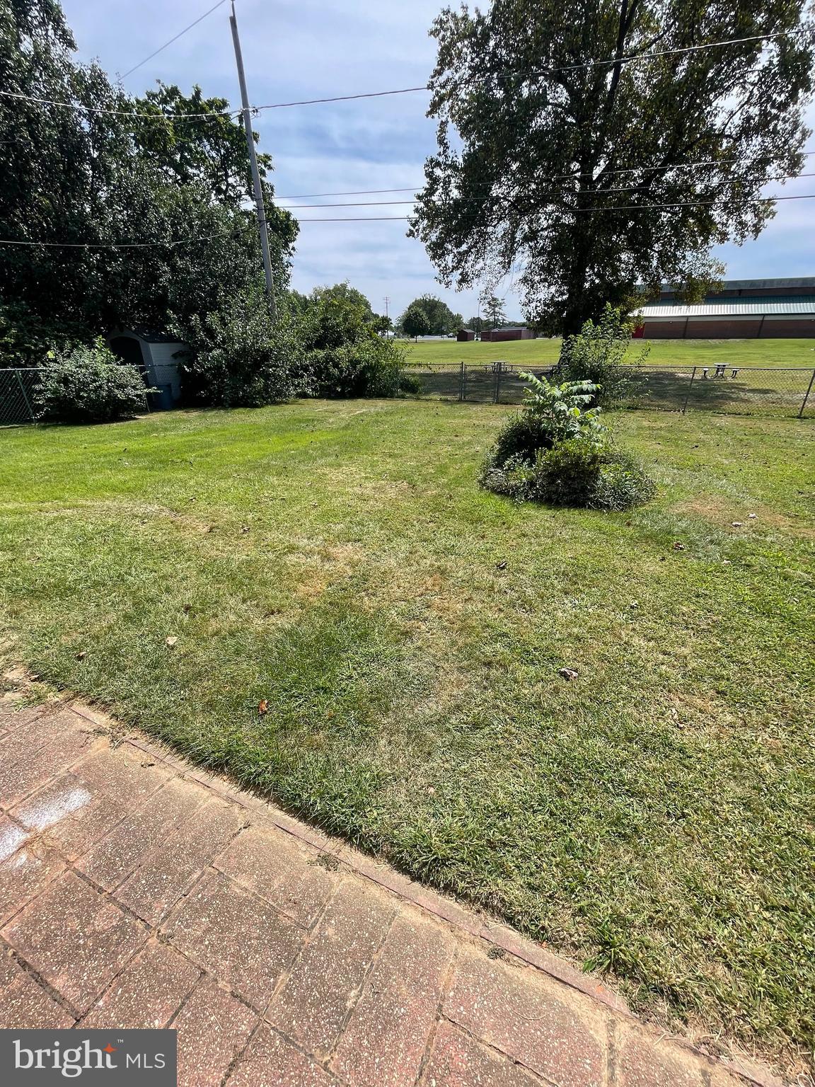 703 Juniper Road Linthicum Heights, MD 21090 - Photo 24 of 26 a view of a yard with an outdoor space