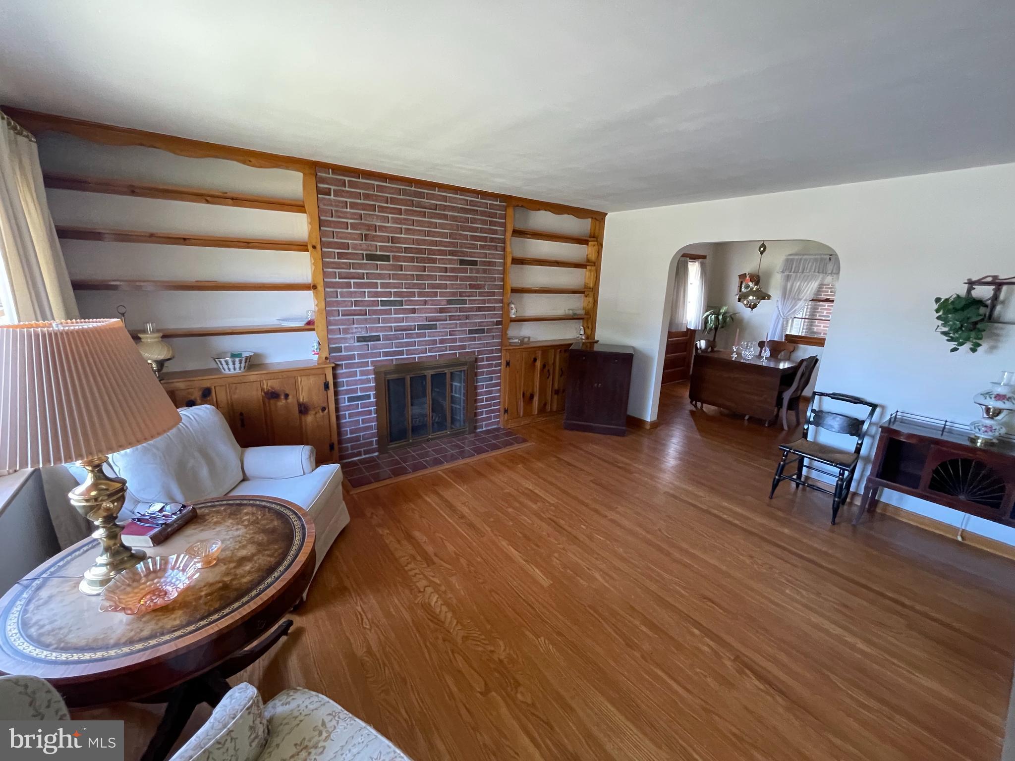 703 Juniper Road Linthicum Heights, MD 21090 - Photo 4 of 26 a living room with furniture and a fireplace