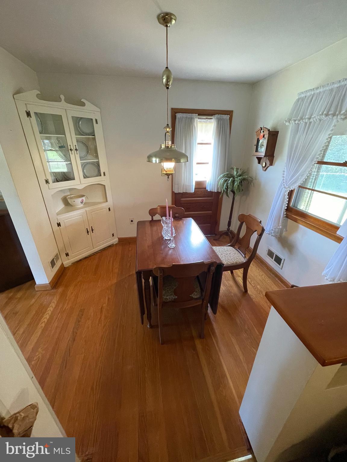 703 Juniper Road Linthicum Heights, MD 21090 - Photo 8 of 26 a view of a dining room with furniture window and wooden floor