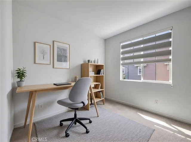 a workspace with furniture and a window