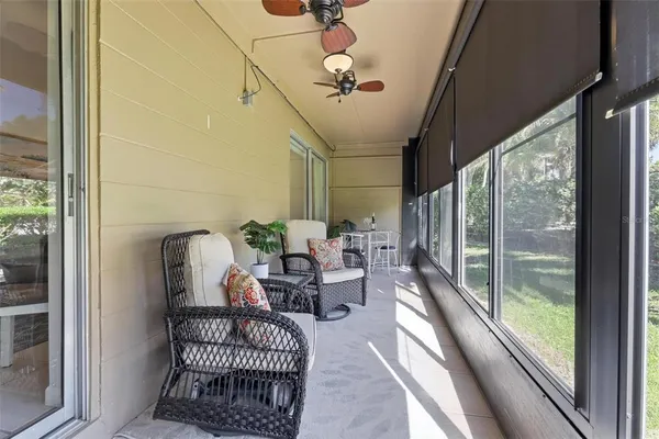 a view of a swimming pool with outdoor seating