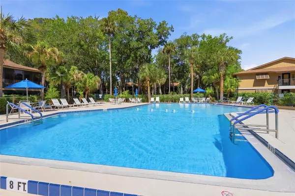 a view of a swimming pool with a patio