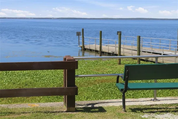 a view of lake with green space