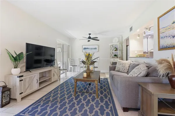 a living room with furniture and a rug