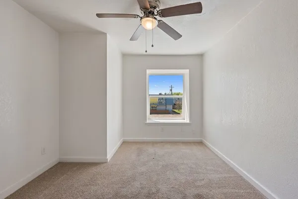 a kitchen with stainless steel appliances granite countertop a stove and a refrigerator