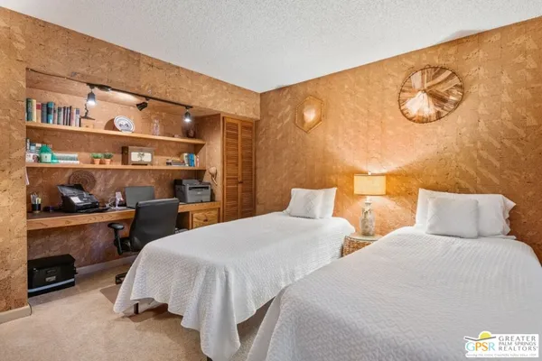 a bedroom with a bed and a table