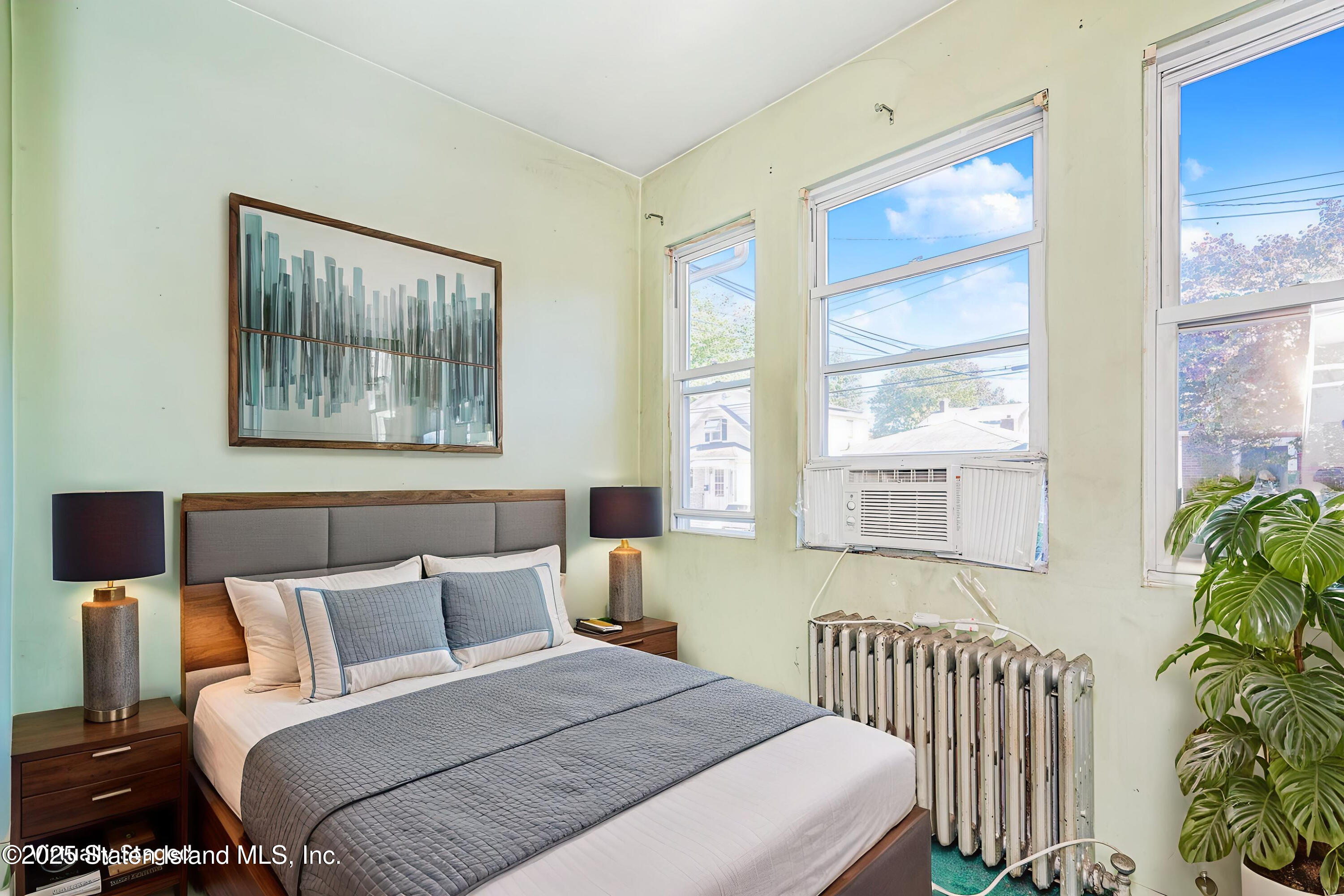 252 Dickie Avenue Staten Island, NY 10314 - Photo 13 of 37 a bedroom with a bed and a window