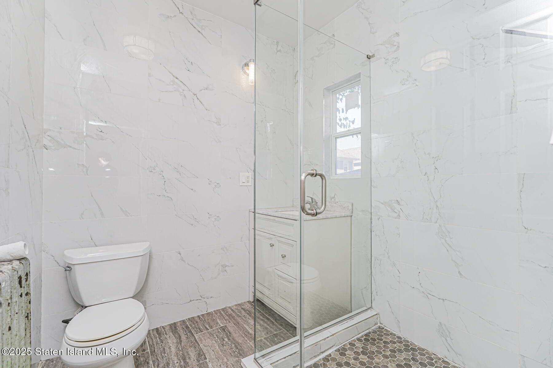 252 Dickie Avenue Staten Island, NY 10314 - Photo 22 of 37 a bathroom with a toilet and a shower