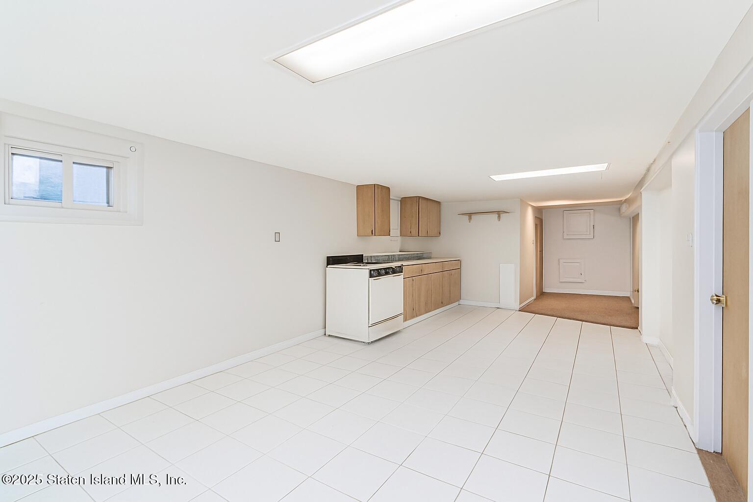 252 Dickie Avenue Staten Island, NY 10314 - Photo 29 of 37 a view of a kitchen with white cabinets