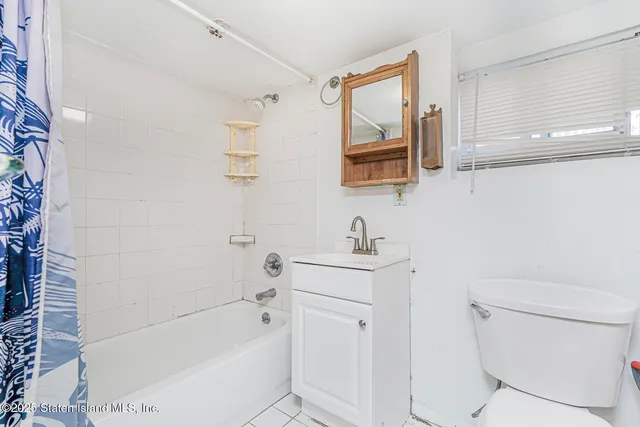 an empty room with a empty space and a window