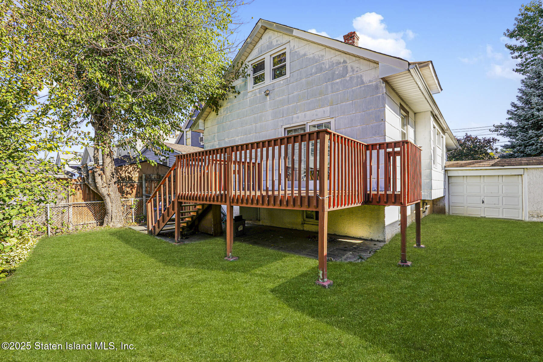 252 Dickie Avenue Staten Island, NY 10314 - Photo 36 of 37 a view of backyard with a garden and deck