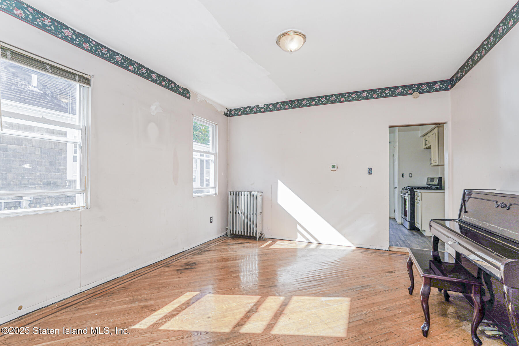 252 Dickie Avenue Staten Island, NY 10314 - Photo 10 of 37 a view of a livingroom with furniture and hardwood floor