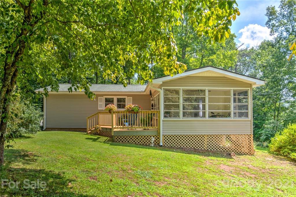 1158 Trammel Gap Road Saluda, NC 28773 - Photo 1 of 32 a front view of a house with a yard