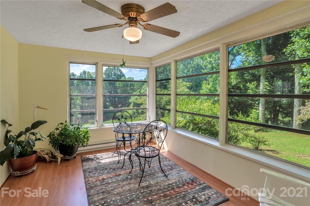 1158 Trammel Gap Road Saluda, NC 28773 - Photo 11 of 32 a living room filled with furniture and a large window