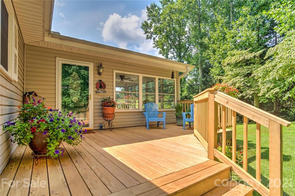 1158 Trammel Gap Road Saluda, NC 28773 - Photo 3 of 32 a view of a chairs and table in the balcony