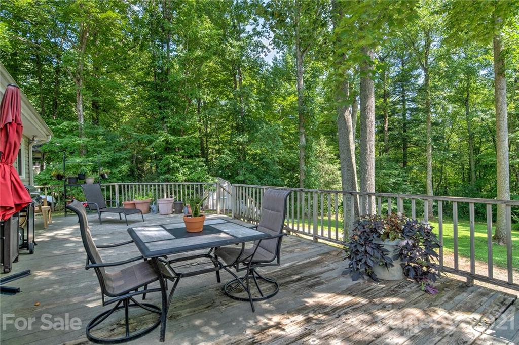 1158 Trammel Gap Road Saluda, NC 28773 - Photo 27 of 32 a view of a chairs and tables in the deck