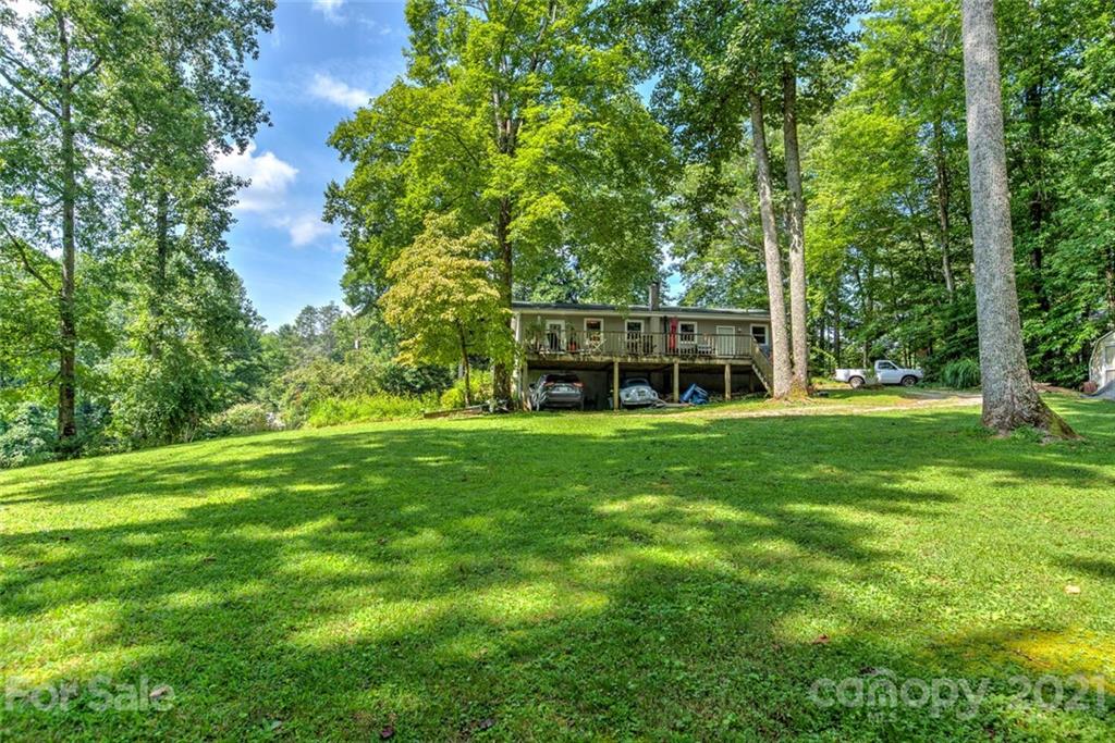 1158 Trammel Gap Road Saluda, NC 28773 - Photo 30 of 32 a view of a house with a big yard