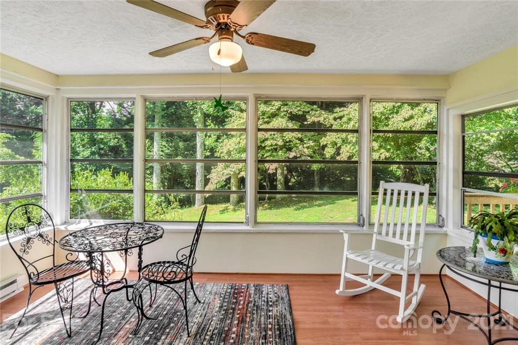 1158 Trammel Gap Road Saluda, NC 28773 - Photo 9 of 32 a view of a dining room with furniture window and outside view