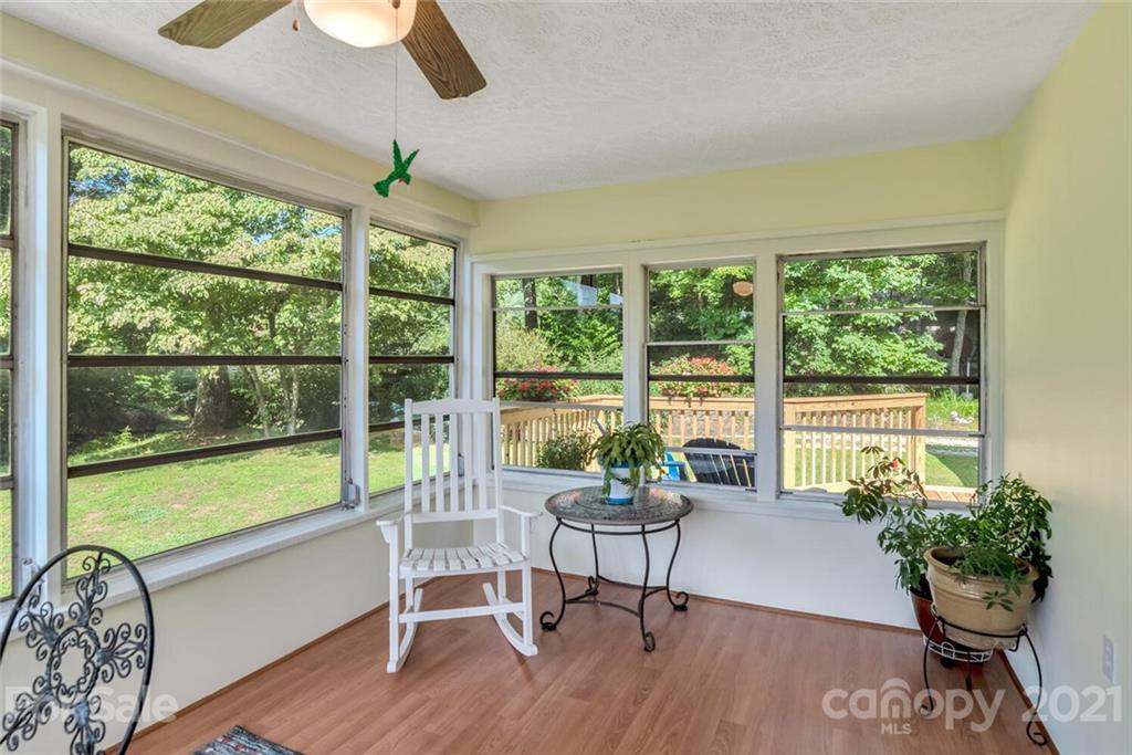 1158 Trammel Gap Road Saluda, NC 28773 - Photo 10 of 32 a living room with furniture and a potted plant