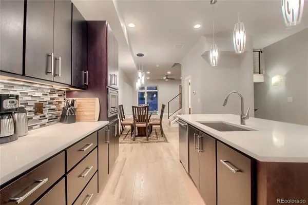 a kitchen with sink cabinets and stove